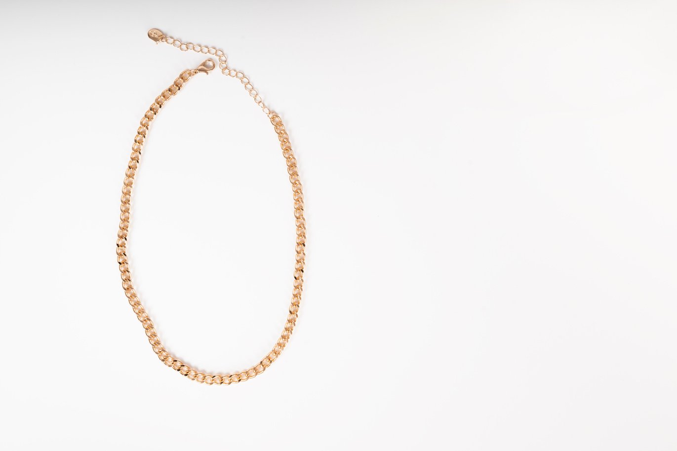 Photo of a necklace top view on white background