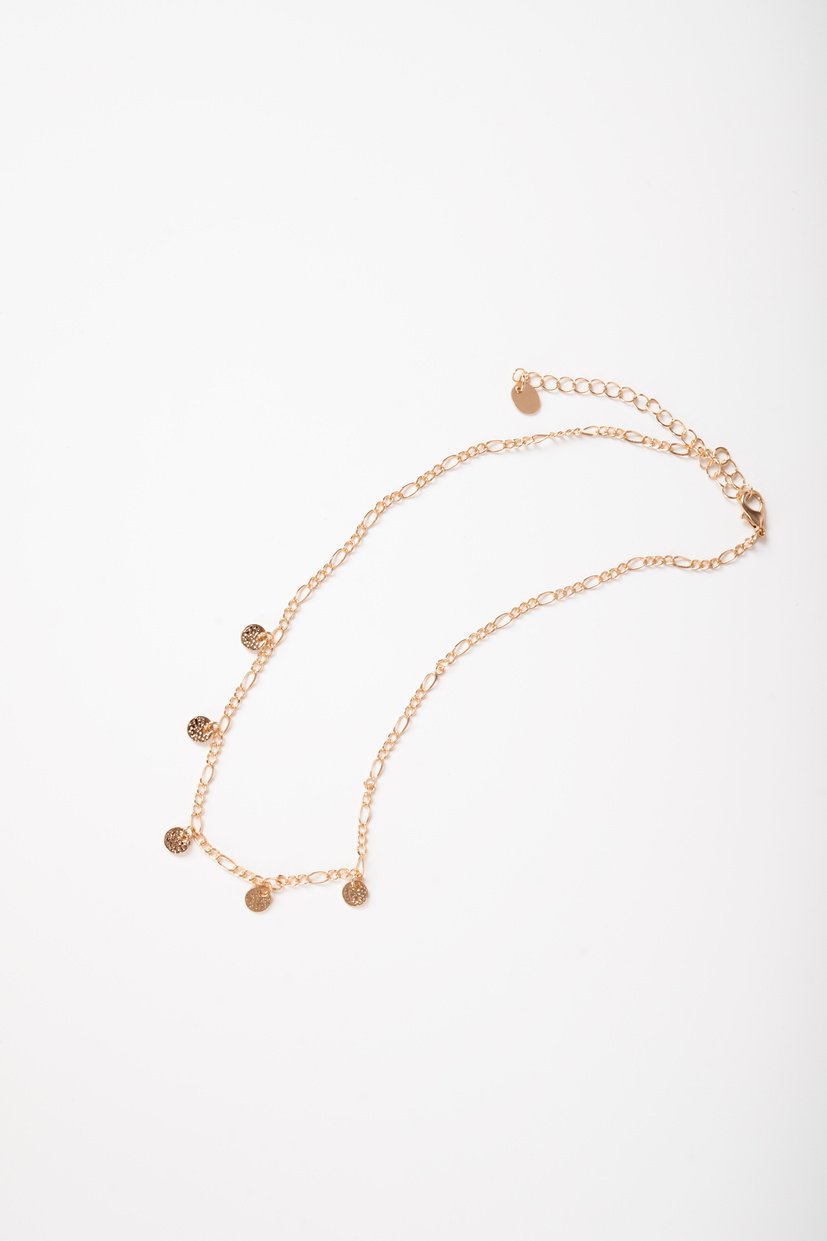 Photo of a necklace top view on white background