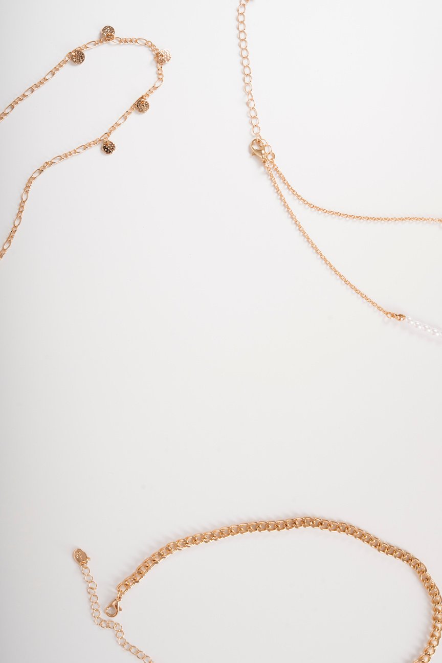 Photo of necklaces top view on white background