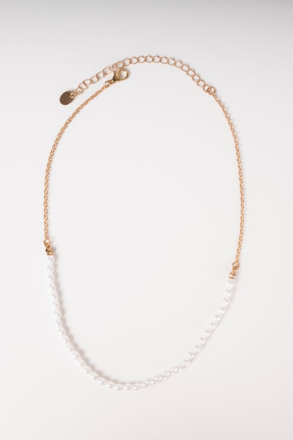 Photo of a necklace top view on white background